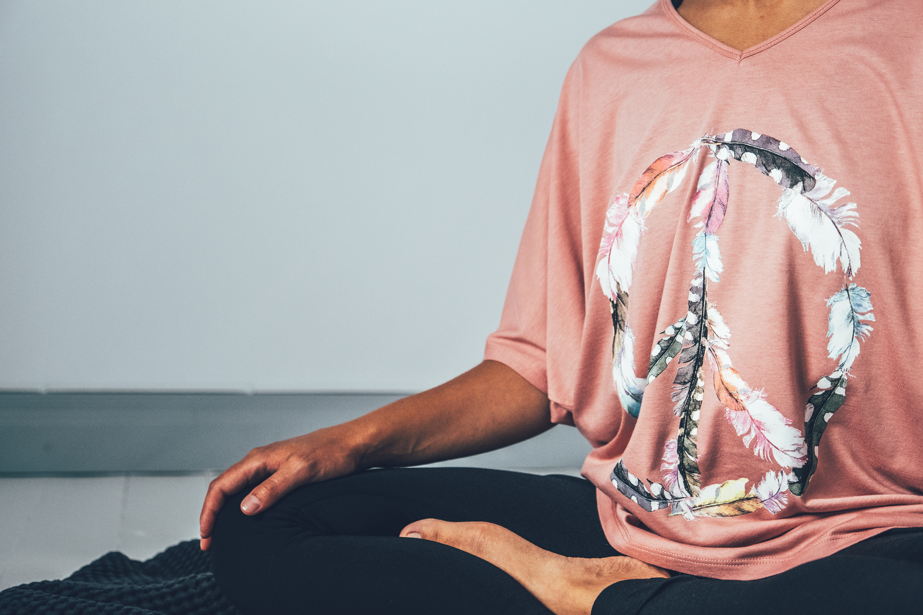 Pink oversized top with a peace-print at front.