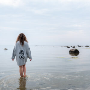 Girl wearing a thighlong Unalome Sweater